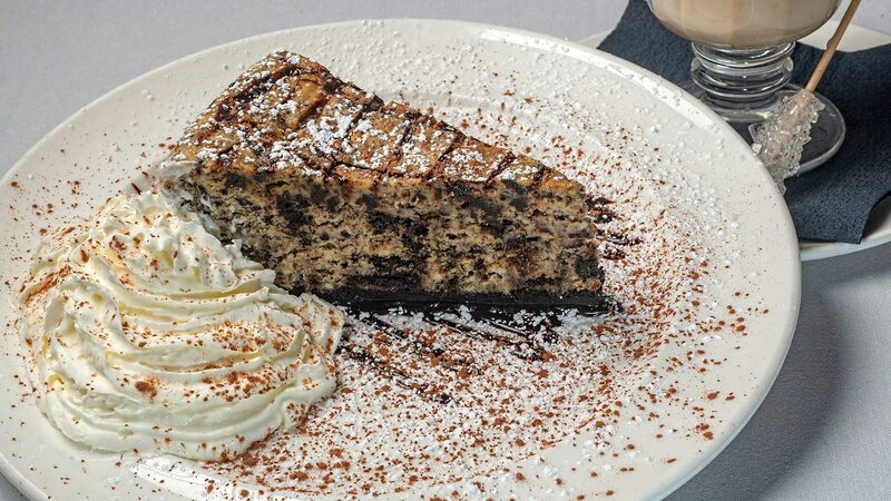 Cake with whipped cream and dusted with brown and white sugar